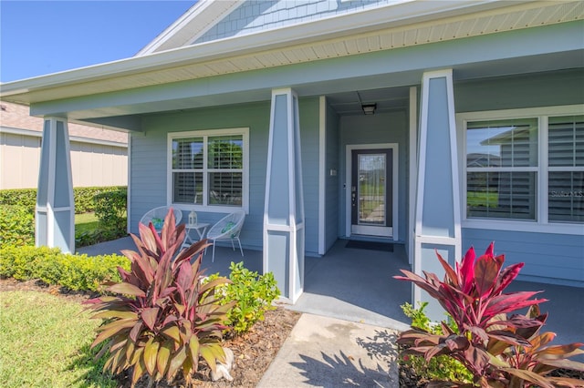 property entrance with covered porch