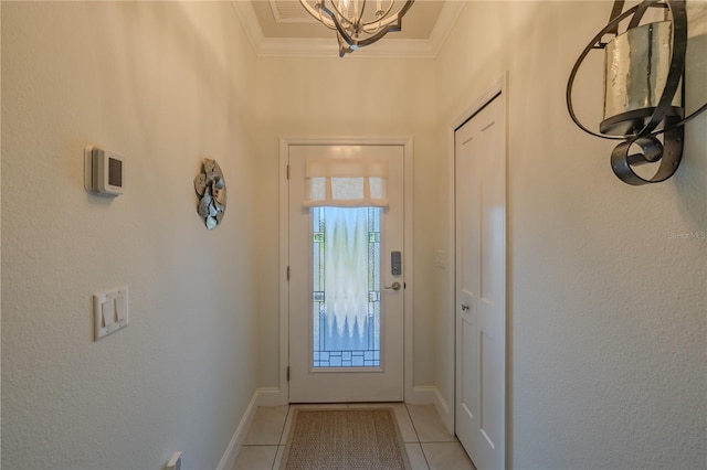 entryway featuring crown molding, light tile patterned floors, and an inviting chandelier