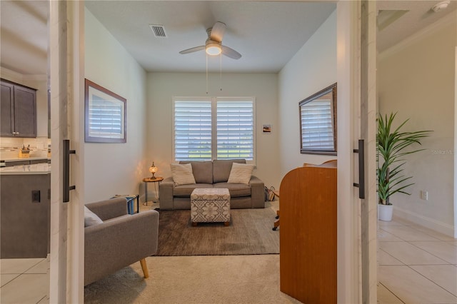 living room featuring ceiling fan and light carpet