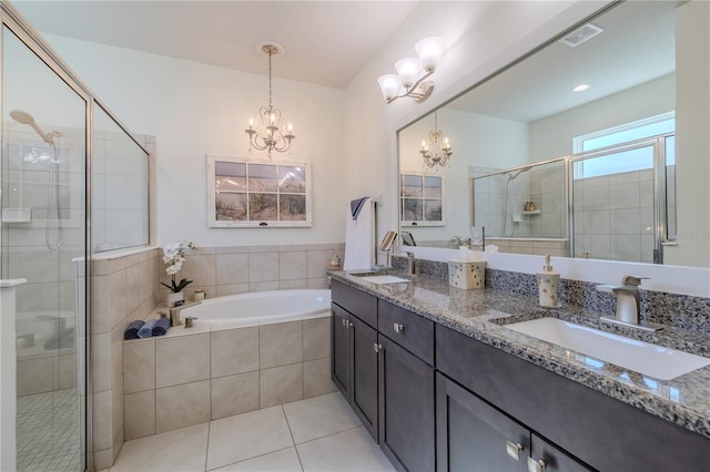 bathroom with a chandelier, vanity, separate shower and tub, and tile patterned floors