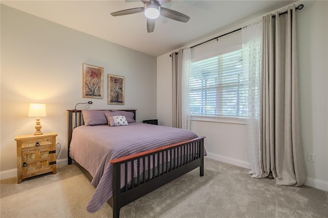 bedroom with ceiling fan and light colored carpet