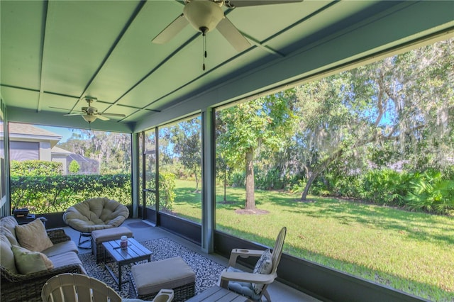 sunroom / solarium featuring ceiling fan