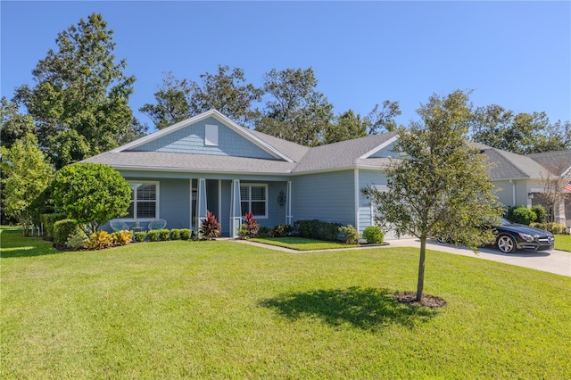 view of front of house featuring a front lawn and covered porch