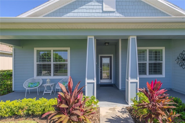 entrance to property featuring a porch