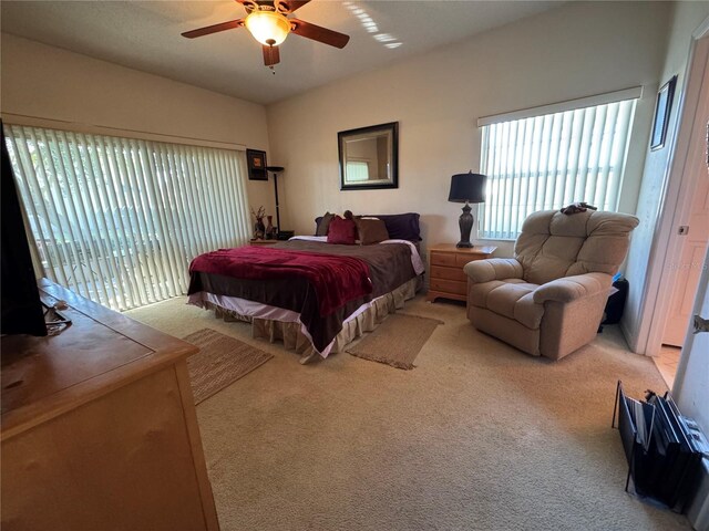 carpeted bedroom with access to exterior and ceiling fan