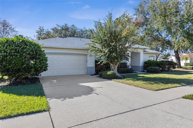 view of front of home featuring a garage and a front yard