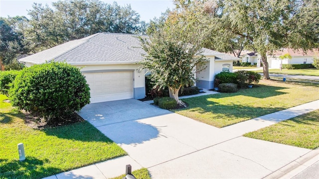 view of front of property with a garage and a front yard