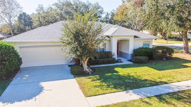 view of front of house featuring a garage and a front yard