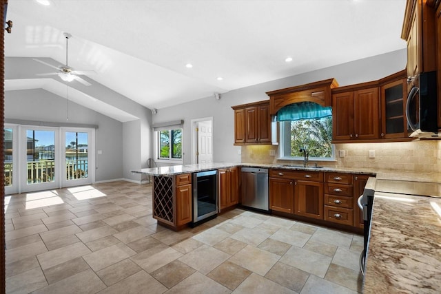 kitchen featuring wine cooler, plenty of natural light, stainless steel appliances, and vaulted ceiling