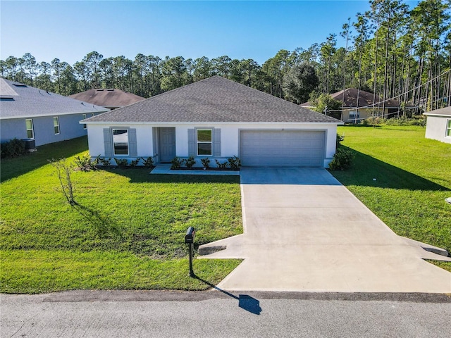 single story home with a garage and a front lawn