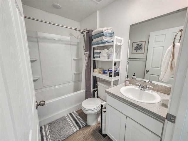 full bathroom featuring toilet, vanity, shower / bathtub combination, and hardwood / wood-style flooring