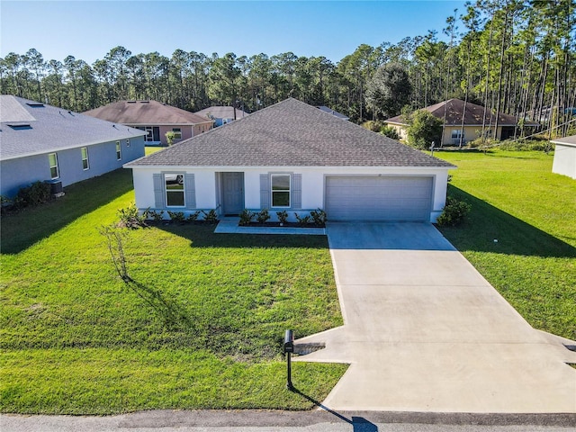 view of front of house with a garage and a front lawn