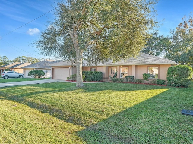 ranch-style home featuring a front yard and a garage