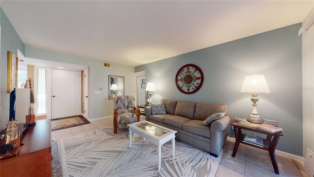 living room with light tile patterned floors