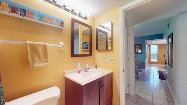 bathroom with tile patterned floors, vanity, and toilet