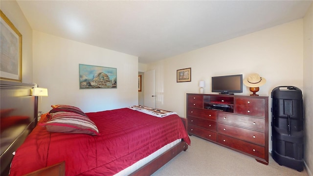 bedroom with light colored carpet