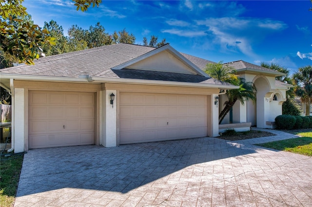 ranch-style home featuring a garage