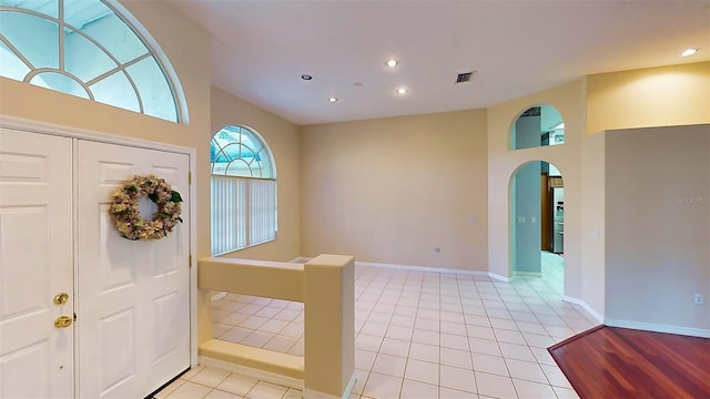 foyer featuring light tile patterned floors