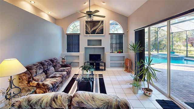 living room with light tile patterned floors, high vaulted ceiling, and ceiling fan