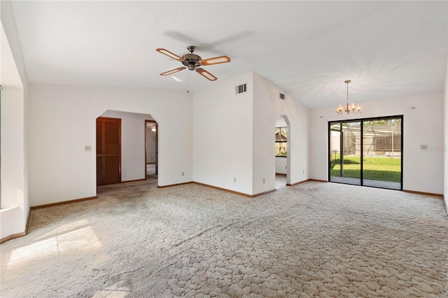 unfurnished living room featuring carpet flooring, lofted ceiling, and ceiling fan with notable chandelier