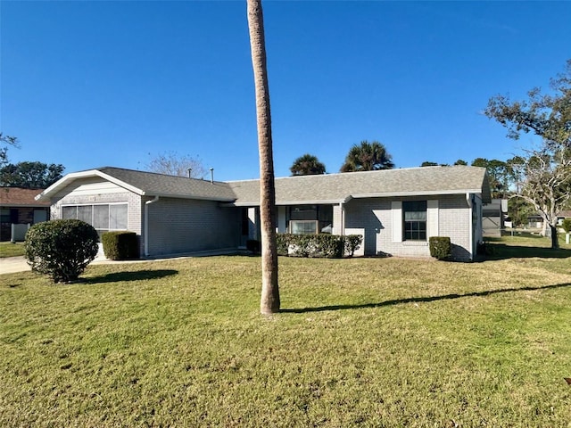 ranch-style house with a front lawn