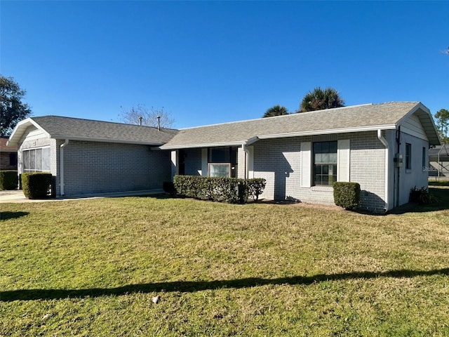 ranch-style house featuring a front lawn