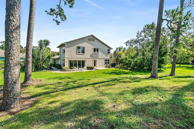 7 Jasmine Run, Ormond Beach, FL 32174 - rear view of property with a patio and a yard
