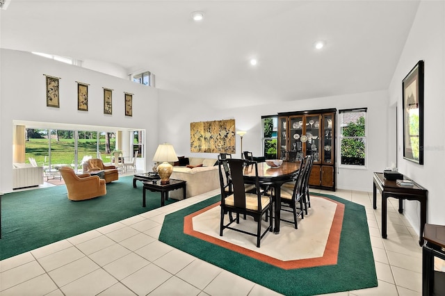 7 Jasmine Run, Ormond Beach, FL 32174 - dining room featuring high vaulted ceiling, tile patterned floors, healthy amount of natural light, recessed lighting, and carpet flooring