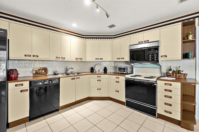 kitchen featuring sink, cream cabinets, white electric range, and black dishwasher