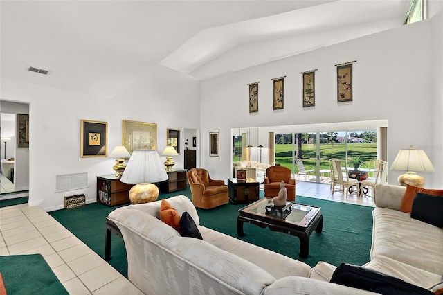 living room with tile patterned floors and vaulted ceiling