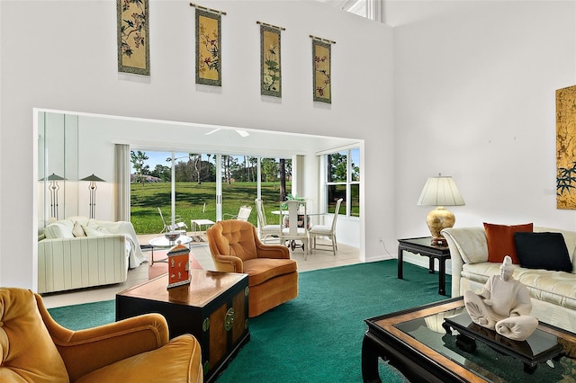 tiled living room with a high ceiling