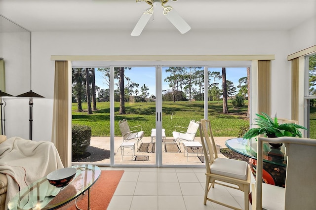 sunroom featuring ceiling fan