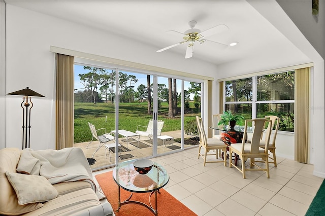 sunroom featuring ceiling fan and a healthy amount of sunlight