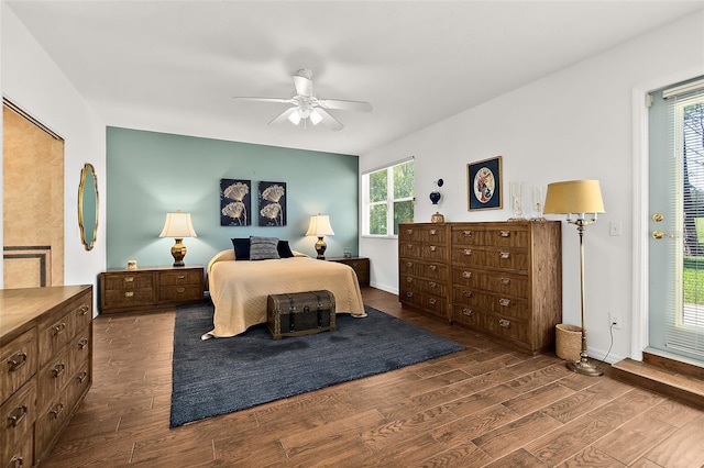 bedroom with access to exterior, ceiling fan, and dark hardwood / wood-style flooring