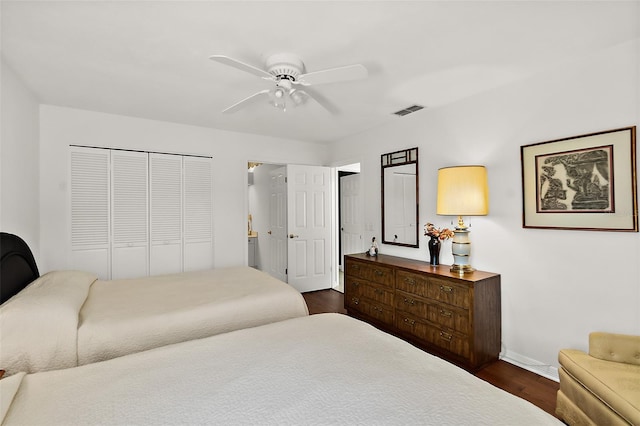 bedroom with a closet, ceiling fan, and dark wood-type flooring