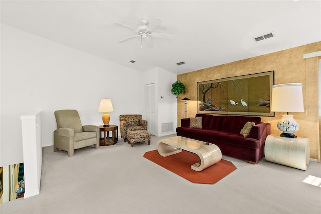 carpeted living room with ceiling fan