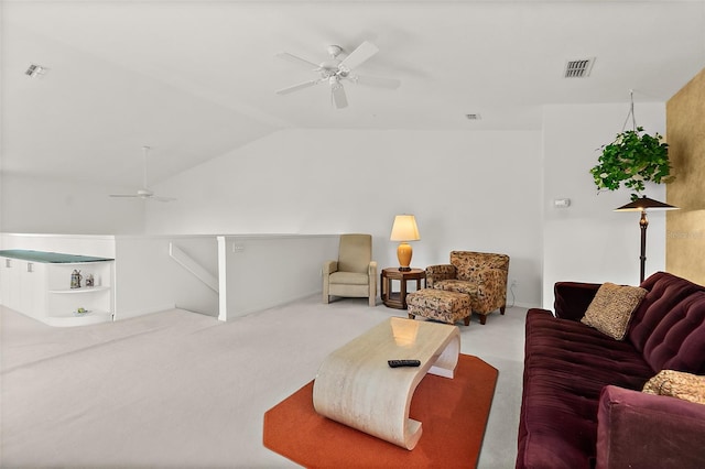 living room featuring carpet, ceiling fan, and lofted ceiling