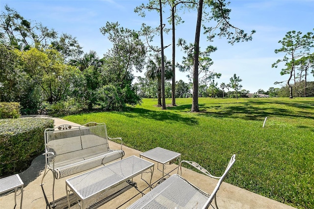 7 Jasmine Run, Ormond Beach, FL 32174 - view of green lawn featuring a patio and view of scattered trees