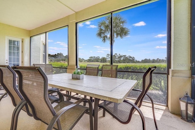 sunroom / solarium with a rural view