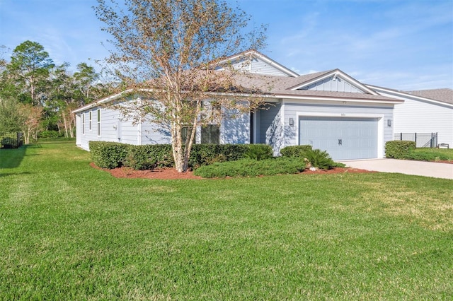 view of front of house featuring a front yard and a garage