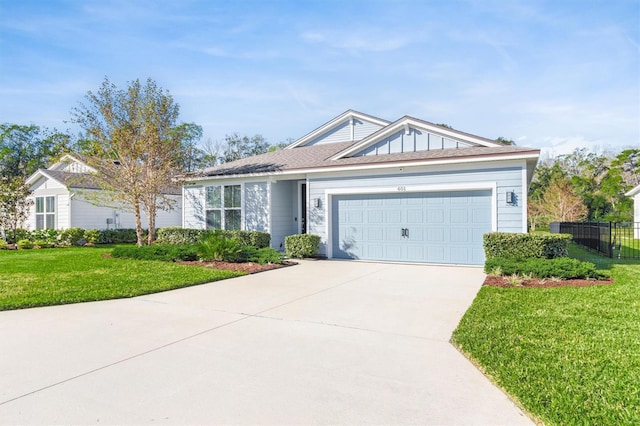 ranch-style house featuring a garage and a front yard