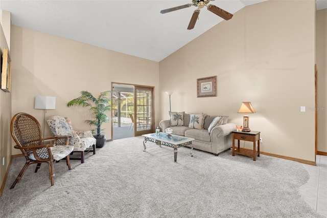 living room with ceiling fan, high vaulted ceiling, and light carpet