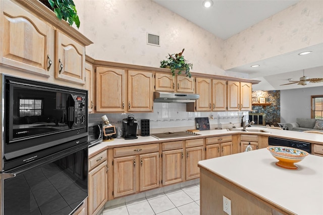 kitchen with light tile patterned floors, sink, light brown cabinets, and black appliances