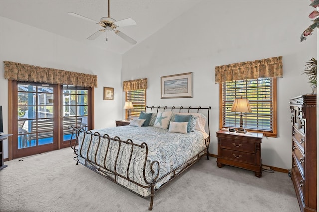 carpeted bedroom featuring access to outside, high vaulted ceiling, and ceiling fan