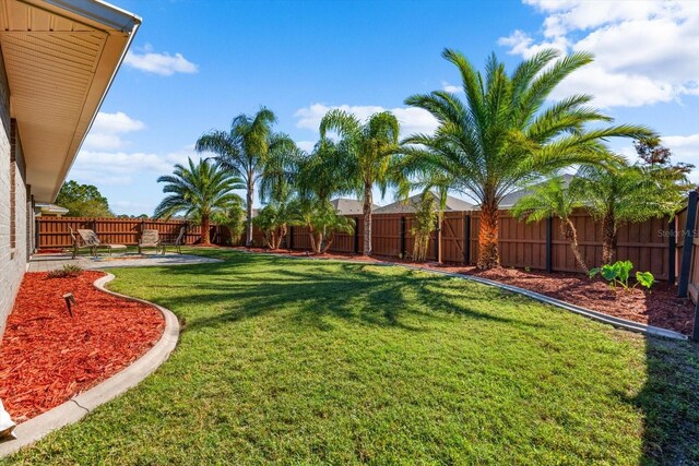 6 Lindsay Dr, Palm Coast, FL 32137 - view of yard featuring a patio area