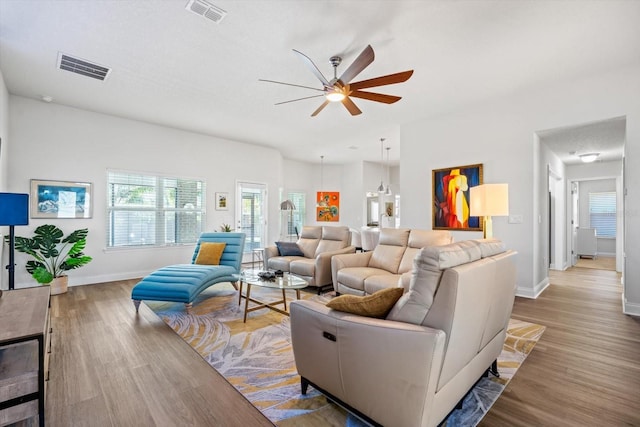 6 Lindsay Dr, Palm Coast, FL 32137 - living area featuring wood finished floors, ceiling fan, and baseboards