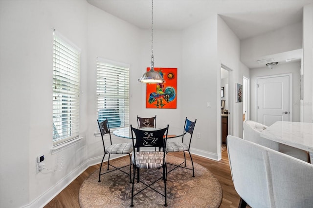 6 Lindsay Dr, Palm Coast, FL 32137 - dining area featuring dark wood-type flooring and baseboards
