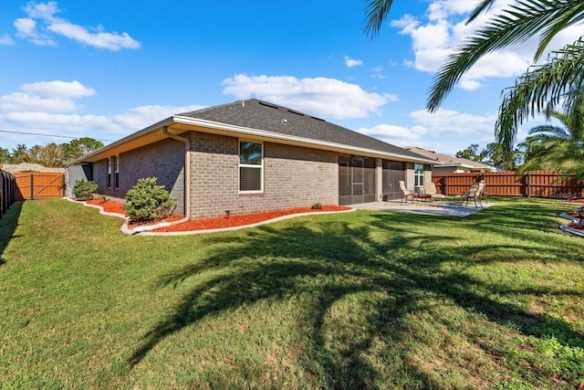 6 Lindsay Dr, Palm Coast, FL 32137 - rear view of house with brick siding, a sunroom, and a patio