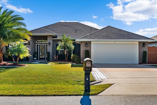 6 Lindsay Dr, Palm Coast, FL 32137 - view of front of property featuring brick siding, a front lawn, concrete driveway, an attached garage, and a shingled roof