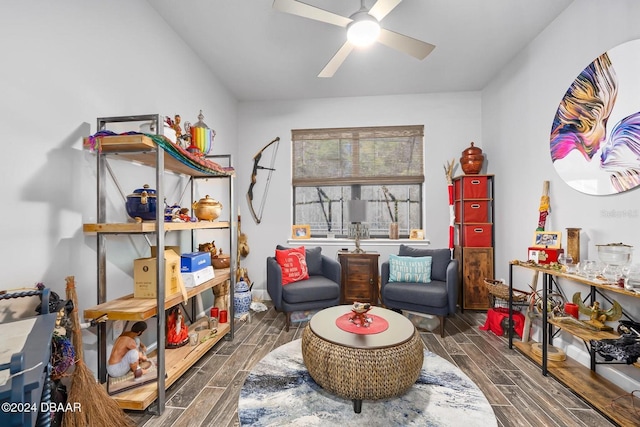 sitting room with ceiling fan and dark hardwood / wood-style flooring